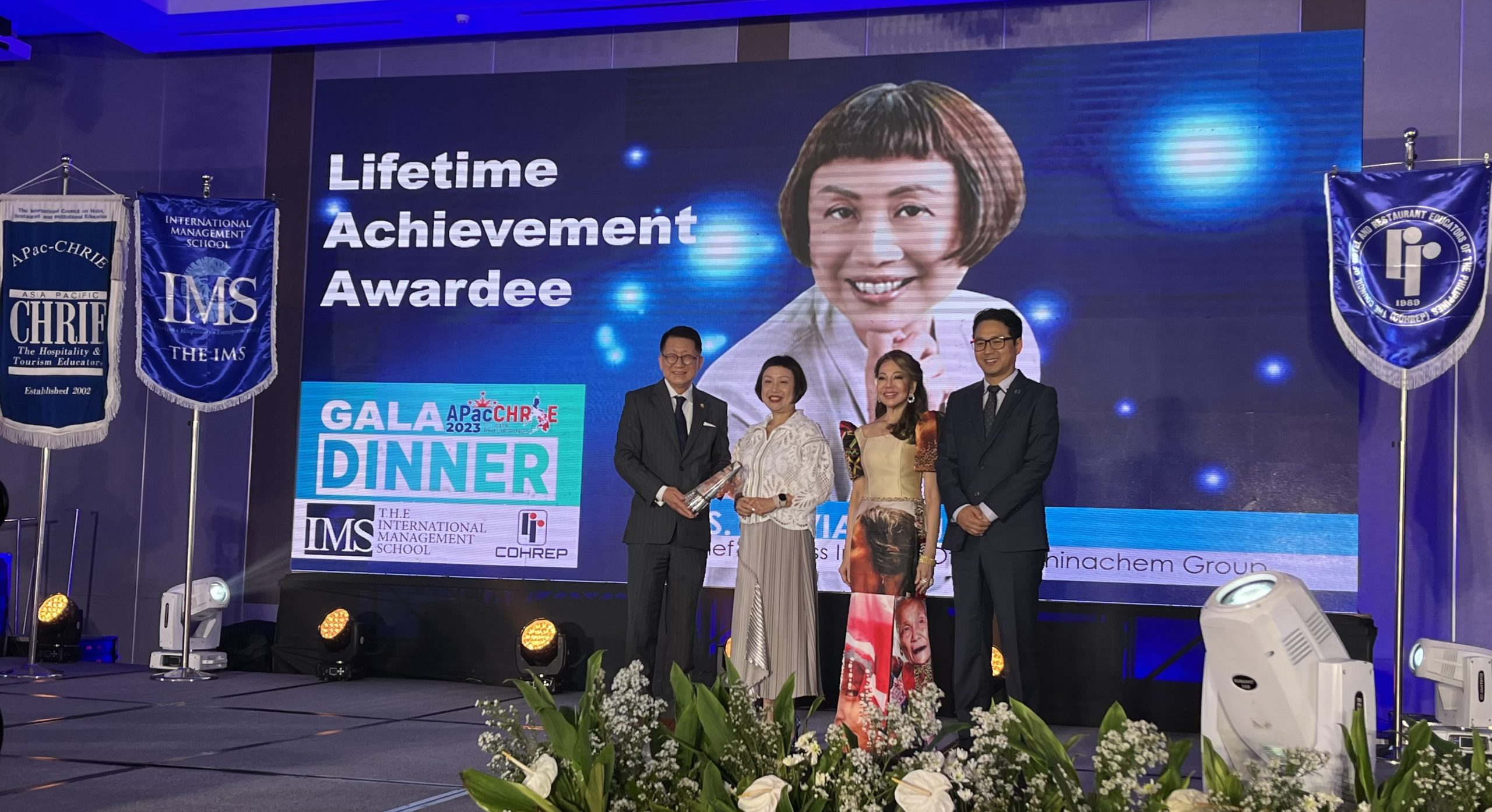Ms. Sylvia Chung receiving the 2023 APacCHRIE Lifetime Achievement Award